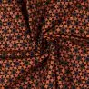 Tissu coton orange imprimé géométrique étoiles noir