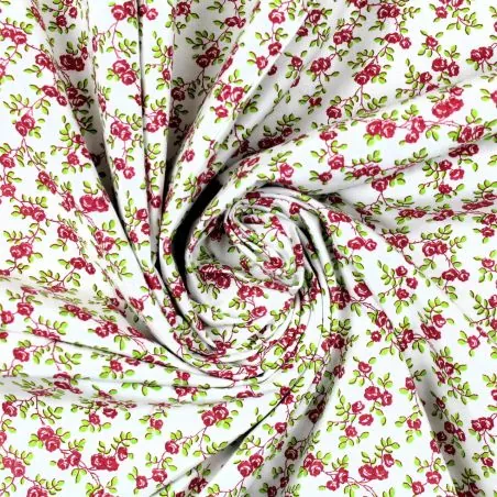 Tissu coton blanc imprimé fleuri framboise