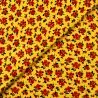 Tissu popeline de coton jaune imprimé fleuri rouge