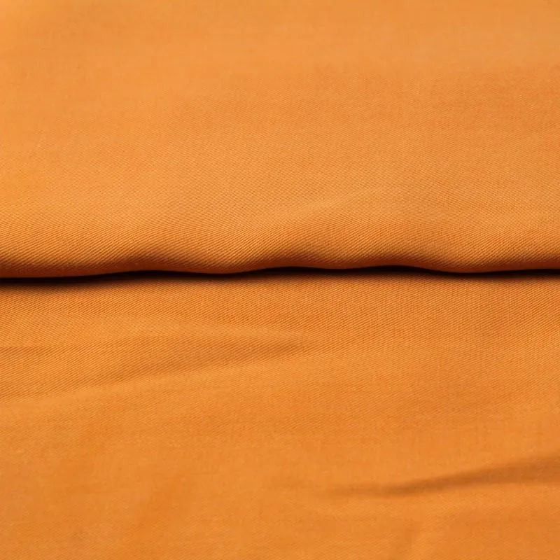 Tissu tencel au mètre fond orange